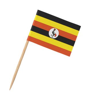 Small paper flag of Uganda on wooden stick, isolated on white
