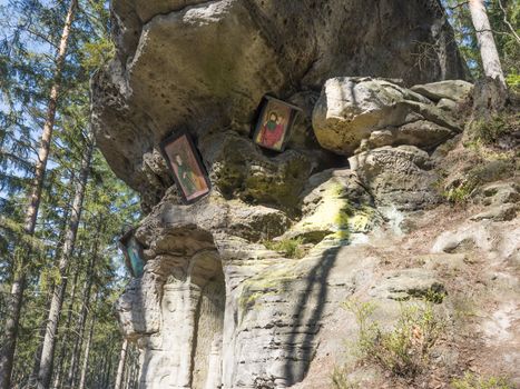 Relief Flight into Egypt sculpted to the sandstone rock in 1740 by joiner Franz Schier in forest near small village Marenicky in luzicke hory, Lusatian Mountains, early spring.