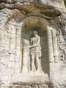 Relief of Christ after flogging sculpted to the sandstone rock in 18th century near village Radvanec in luzicke hory, Lusatian Mountains, spring.