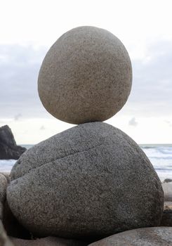 Stone pyramid - stone laid on other stone on seacoast