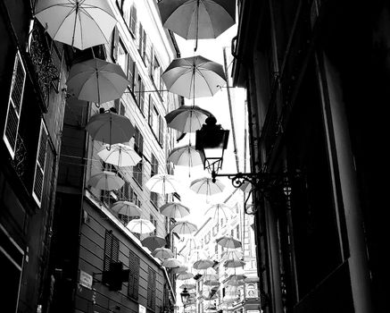 Genova, Italy - 06/25/2020:Bright abstract background of jumble of rainbow colored umbrellas over the city celebrating gay pride