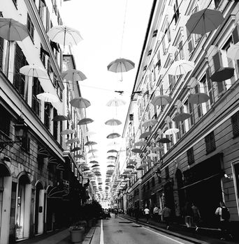 Genova, Italy - 06/25/2020:Bright abstract background of jumble of rainbow colored umbrellas over the city celebrating gay pride