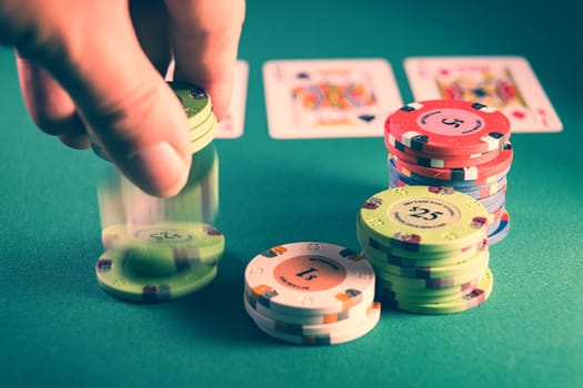 Man playing Poker at the casino table