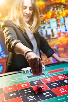 Woman playing roulette at the casino - Shallow depth of field