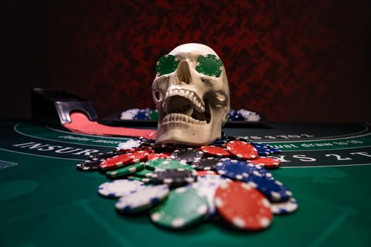 Human skull at Black Jack table 