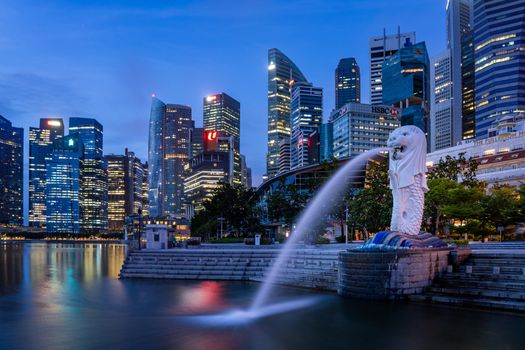 SINGAPORE CITY SINGAPORE: FEBRUARY 13 2020: Singapore Merlion Park downtown Singapore  business district at sunrise