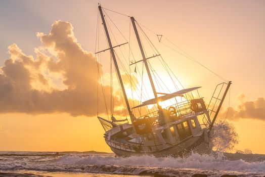 A Sailing boat wreck at sunset