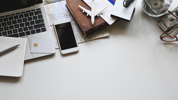 Travel stuff on the white table. Vacation travelling concept.