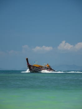 Ao Nang, Thailand - FEBRUARY 18, 2019: Traditional long tail boat on Ao Nang beach in Krabi Thailand