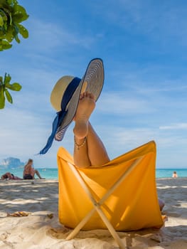 Legs of a woman at the beach