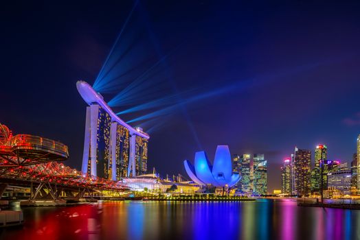 SINGAPORE CITY, SINGAPORE - MARCH 3, 2019: Spectra Light and Water Show Marina Bay Sand Casino Hotel Downtown Singapore 