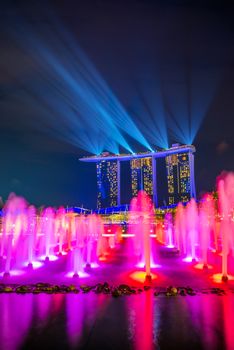 SINGAPORE CITY, SINGAPORE - MARCH 4, 2019: Spectra Light and Water Show Marina Bay Sand Casino Hotel Downtown Singapore 
