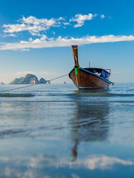 Traditionnal Long tail boat at sunset in Thailand