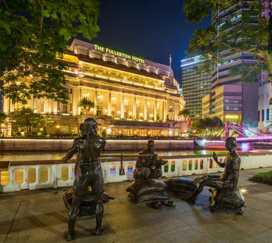 SINGAPORE CITY, SINGAPORE - APRIL 22, 2018: Fullerton hotel in downtown Singapore at night