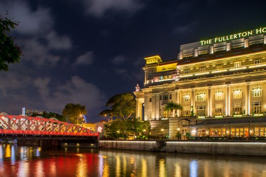 SINGAPORE CITY, SINGAPORE - APRIL 22, 2018: Fullerton hotel in downtown Singapore at night
