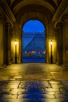 PARIS, FRANCE - DECEMBER 5 2018: Louvre Museum at night in Paris France - The world's most visited museum