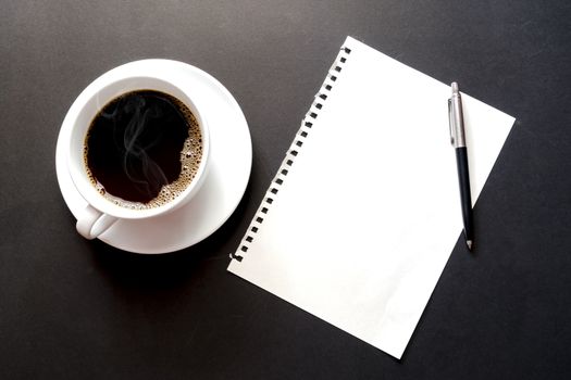Empty paper sheet , cup coffee and pen on Black background, paper note for add text message.
