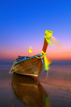 Traditionnal Thai long tail boat at sunset