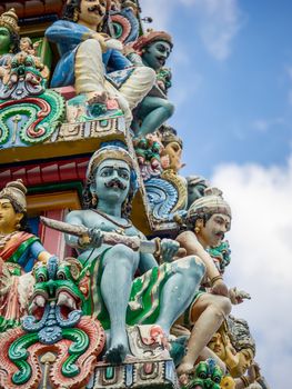 The Sri Mariamman Hindu Temple in Chinatown, Singapore. Fragment of decoration with painted figures of Hindu gods and deities.