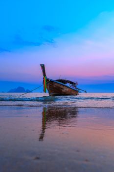 Traditionnal Thai long tail boat at sunset