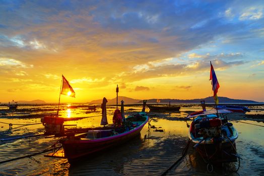 Traditionnal Thai long tail boat at sunset