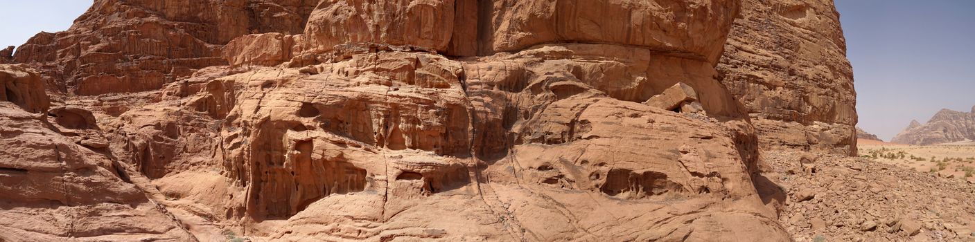 Composite panorama of high resolution aerial photos of a monolithic mountain in the central area of the desert reserve of Wadi Rum, Jordan, middle east, made from near distance