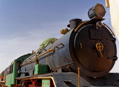 The ancient steam locomotive, still in use, in the desert of Wadi Rum, Jordan