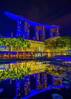 SINGAPORE CITY, SINGAPORE - APRIL 14, 2018: Marina Bay Sands at night the largest hotel in Asia. It opened on 27 April 2010. Singapore on April 14, 2018