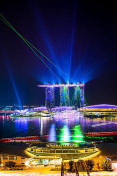 SINGAPORE CITY, SINGAPORE - APRIL 22, 2018: Spectra Light and Water Show Marina Bay Sand Casino Hotel Downtown Singapore on APRIL 22, 2018