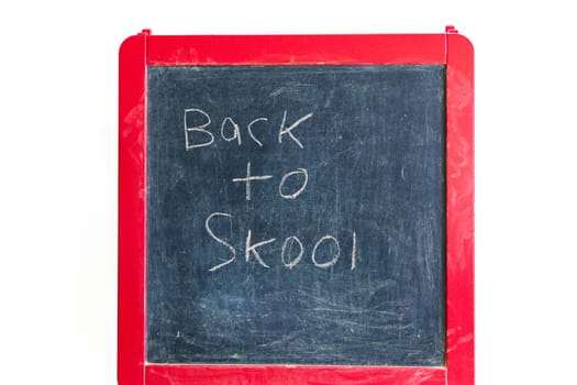 Back to school. Old school blackboard with written message of 'Back to Skool'.