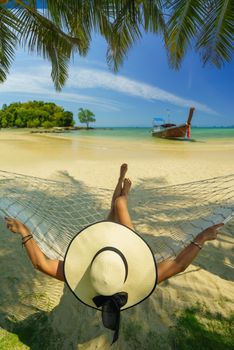 Woman on a hammock at the beach