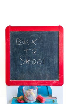 Back to school. Old school blackboard with written message of 'Back to Skool'.