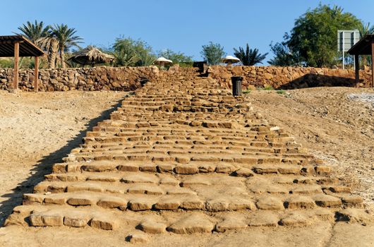 Old long staircase of roughly hewn sandstones leading to the beach of the Dead Sea in Jordan,. middle east