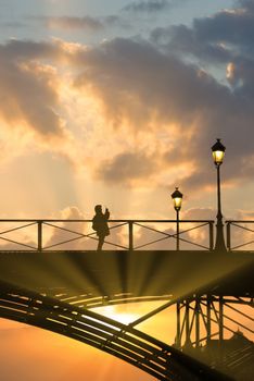 River Seine with Pont des Arts and Institut de France at night in Paris, France