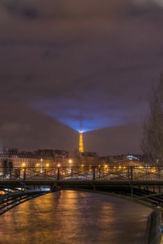 River Seine with Pont des Arts and Institut de France at night in Paris, France