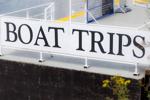 Information sign advertising tourist boat trips