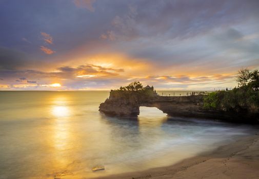 Temple in the sea Pura tanah lot Bali Indonesia at sunset