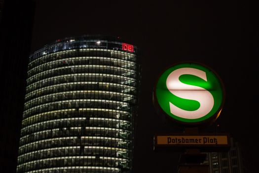 Berlin, Germany, February 2013: Potsdamer platz and Subway at night, with DB (Deutsche Bahn) office in the background