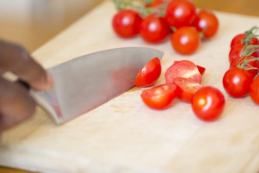 Black Man Chopping Tomatoes