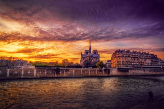 Notre Dame Cathedral with Paris cityscape at dusk, France
