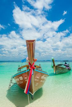 PHI PHI ISLAND, THAILAND - FEBRUARY 24: Longtail boat taxi on the Long Beach on February 24 2017  in Phi Phi island, Thailand. The Phi Phi island island has no roads. The best form of travel is by sea.