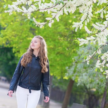 Beautiful young girl in a park on a spring day