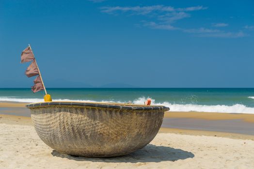 Traditional fishing boat on the beach of Hoi An