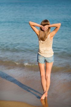 Beautiful young girl on the beach