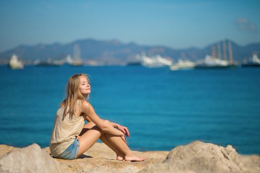Beautiful young woman relaxing on the beach