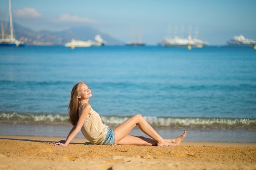 Beautiful young woman relaxing on the beach