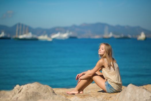 Beautiful young woman relaxing on the beach