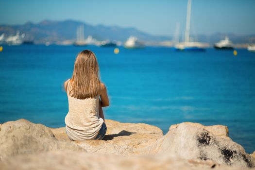 Beautiful young woman relaxing on the beach