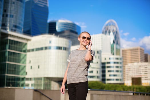 Young confident business woman speaking on the mobile phone