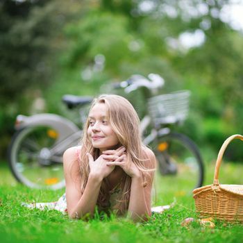 Beautiful young girl spending her time in the countryside